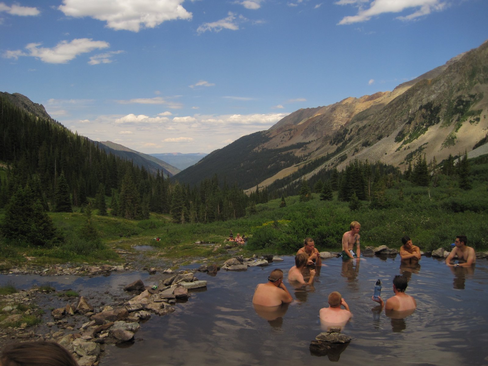 Soaking at Conundrum Hot Springs above Conundrum Creek valley