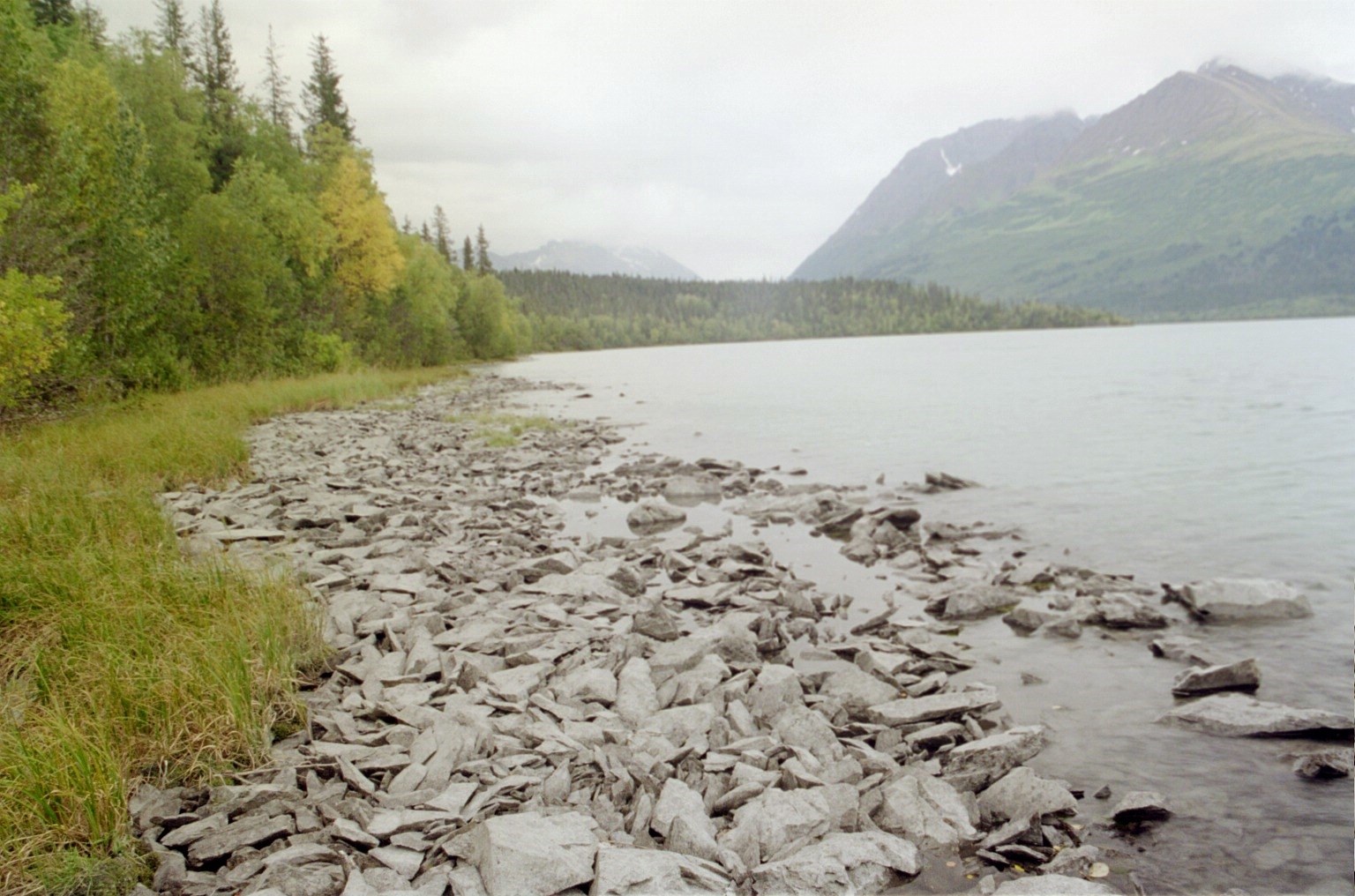A rocky lakeshore along the Johnson Pass Trail